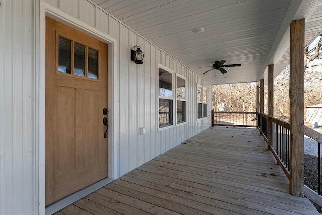 wooden terrace featuring ceiling fan and covered porch