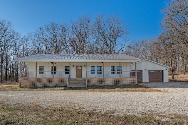 view of front of home with a porch and a garage