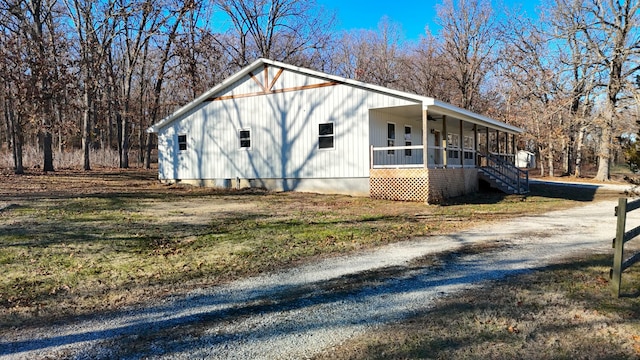 view of home's exterior featuring a porch and ceiling fan