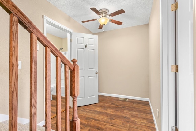 interior space featuring hardwood / wood-style floors, a textured ceiling, and ceiling fan