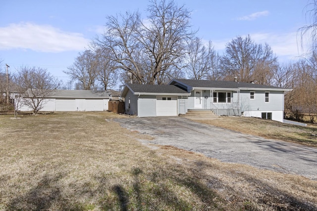 view of front of property with a garage and a front lawn