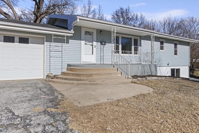 view of front facade with a garage and covered porch