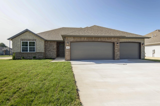 view of front of property featuring a garage and a front yard