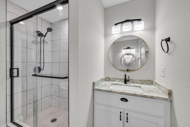 bathroom with vanity and an enclosed shower