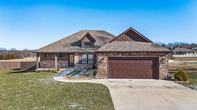 view of front of home featuring a garage and a front yard