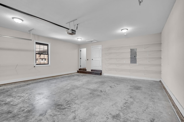 garage featuring a garage door opener and electric panel