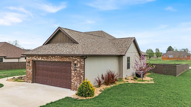 2320 Aid Hodgson Ln, West Plains, MO 65775 - view of property exterior featuring driveway, fence, a garage, a lawn, and a shingled roof
