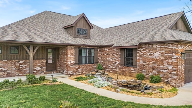 2320 Aid Hodgson Ln, West Plains, MO 65775 - view of front facade with brick siding, a garage, and roof with shingles