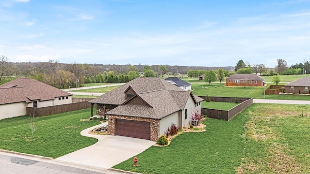 2320 Aid Hodgson Ln, West Plains, MO 65775 - view of front of property with fence, an attached garage, driveway, a front lawn, and a shingled roof