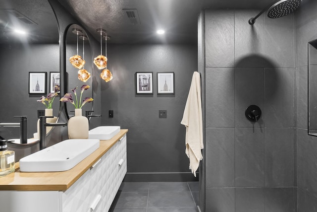 bathroom with vanity and a shower