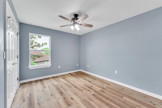 empty room featuring ceiling fan and light hardwood / wood-style floors