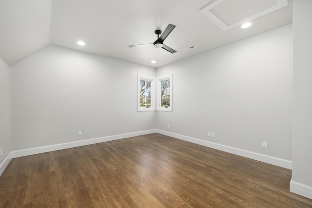 spare room with dark wood-type flooring, ceiling fan, and lofted ceiling