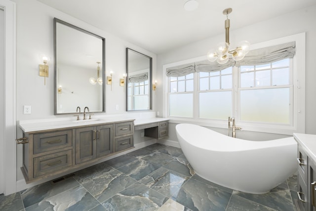 bathroom with an inviting chandelier, vanity, a bath, and a wealth of natural light