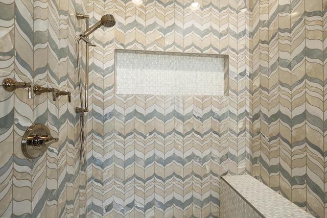 bathroom with a tile shower