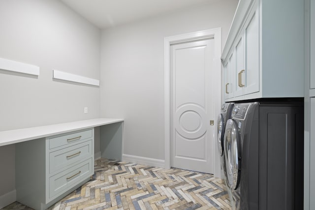 laundry room with cabinets and washing machine and dryer