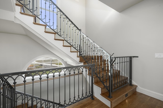 stairs featuring hardwood / wood-style flooring