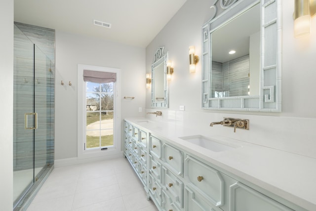 bathroom with vanity and an enclosed shower