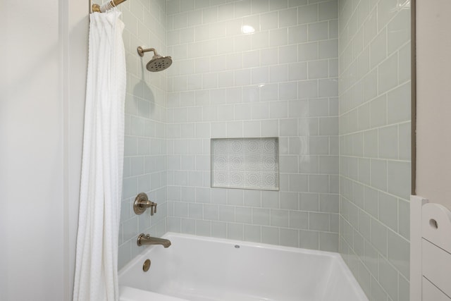 bathroom featuring shower / bathtub combination with curtain