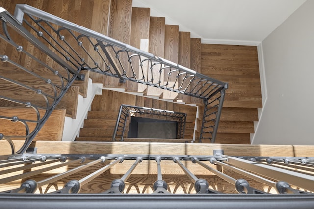 stairway with wood walls