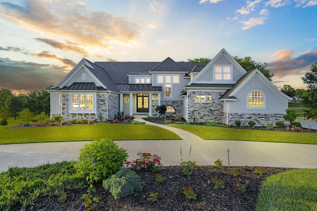 craftsman-style home featuring a lawn