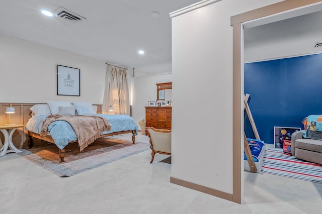 bedroom featuring concrete flooring