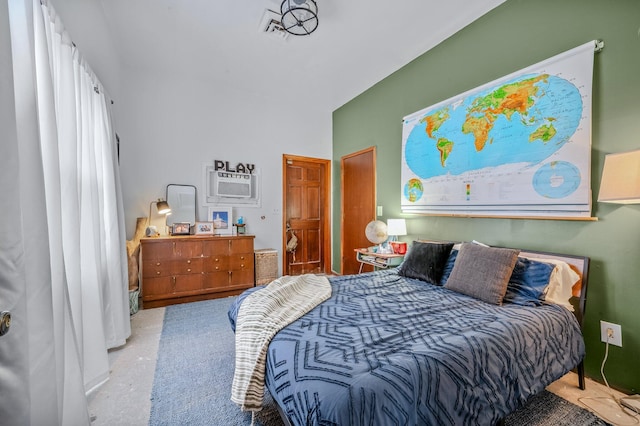 bedroom featuring a wall unit AC