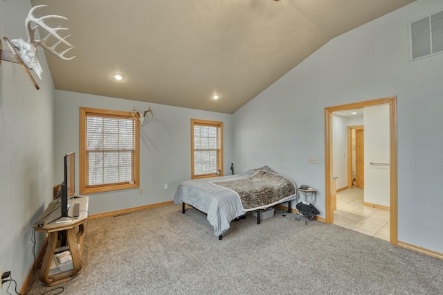 carpeted bedroom with vaulted ceiling