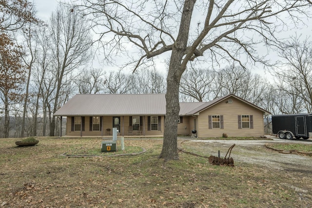 view of front of home featuring a front yard and a porch