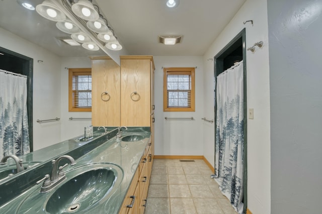 bathroom with vanity and tile patterned flooring