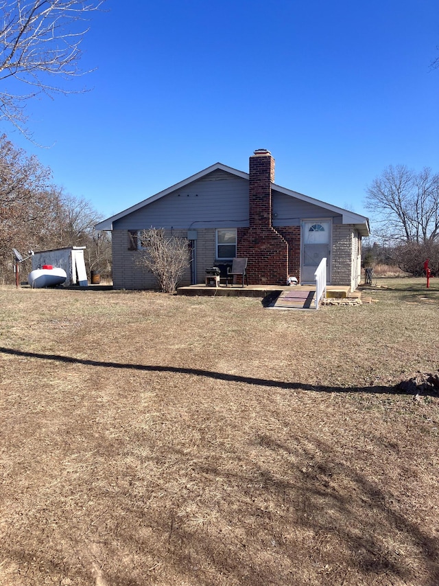 back of house with a yard