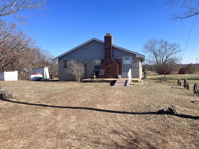 rear view of house with a lawn