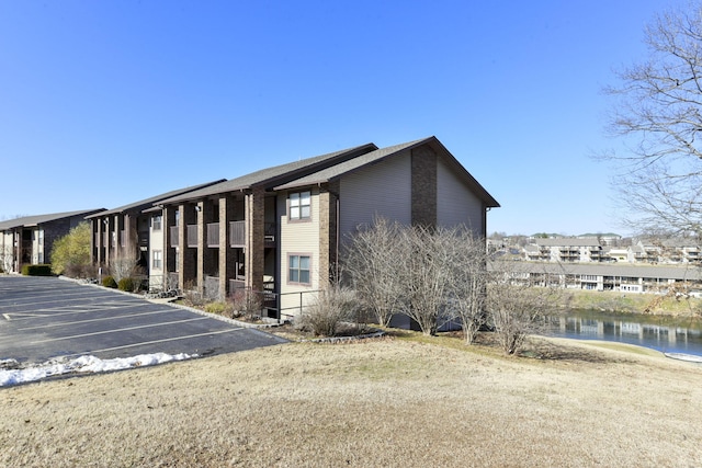 view of building exterior with a water view