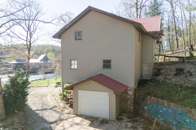 view of property exterior with a garage