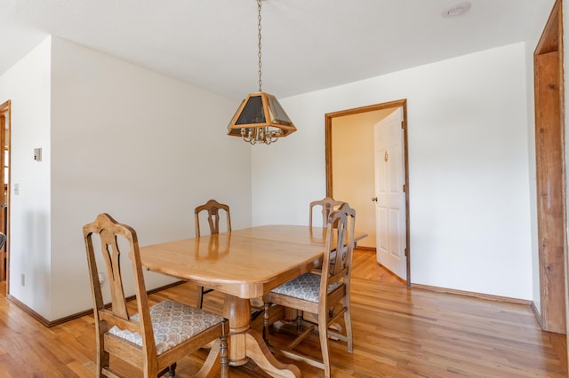 dining area featuring light wood-type flooring