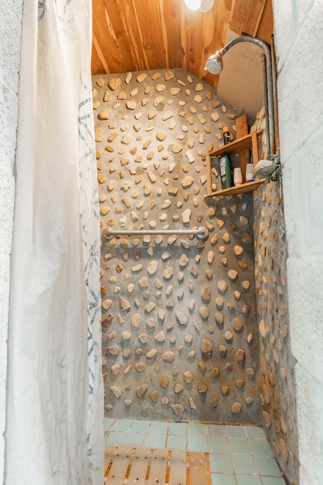 bathroom with wood ceiling