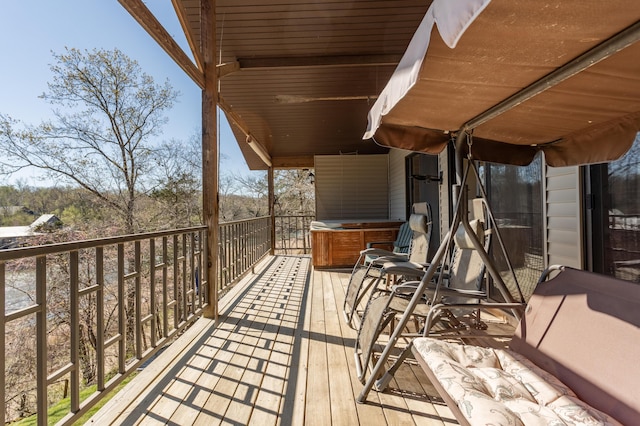 wooden terrace featuring a hot tub