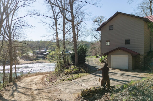 view of side of home with a garage