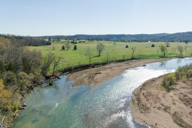 aerial view with a rural view and a water view