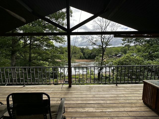 wooden deck featuring a water view