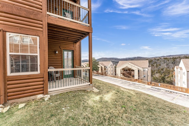 view of yard featuring a balcony