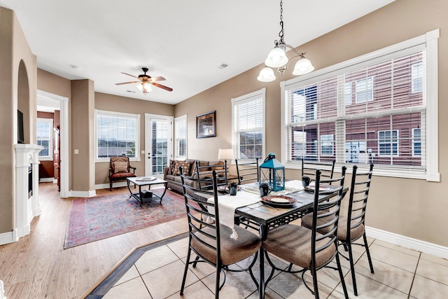 dining space with ceiling fan and light hardwood / wood-style floors