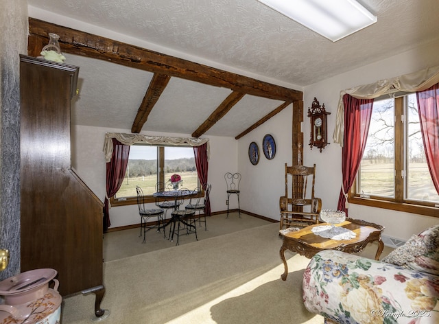 living room with carpet floors, a textured ceiling, and vaulted ceiling with beams