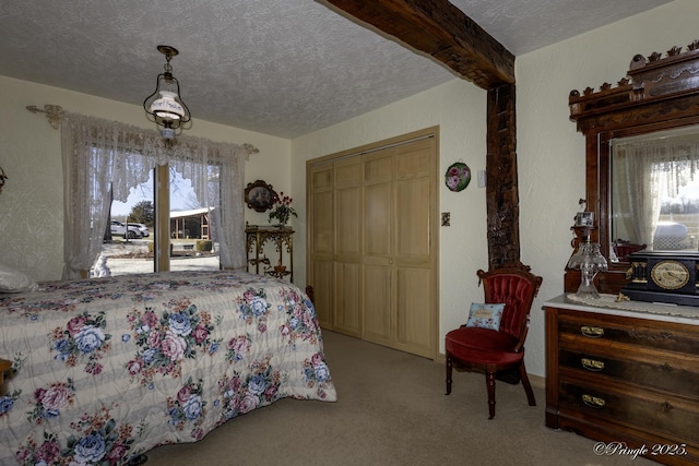 bedroom with beamed ceiling, light colored carpet, a closet, and a textured ceiling