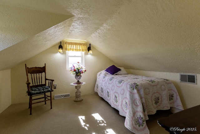 carpeted bedroom with lofted ceiling and a textured ceiling