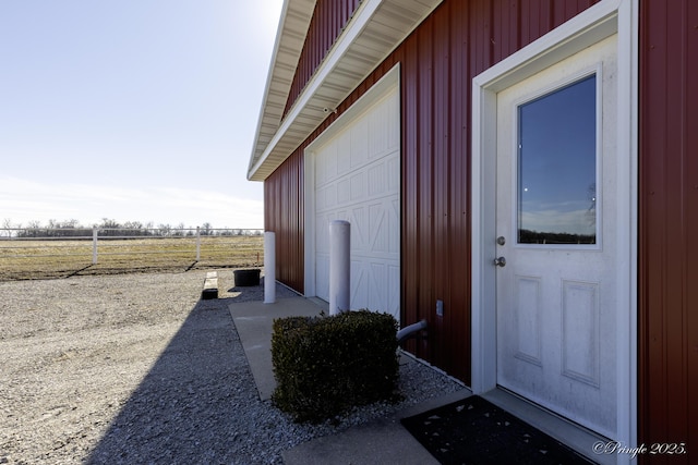 view of exterior entry with a rural view