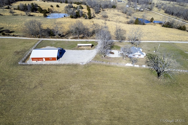 birds eye view of property with a rural view