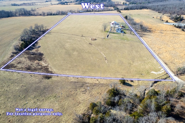 birds eye view of property featuring a rural view