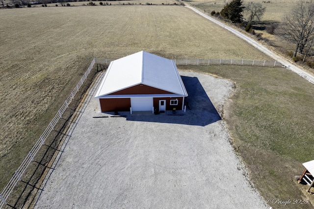 birds eye view of property featuring a rural view