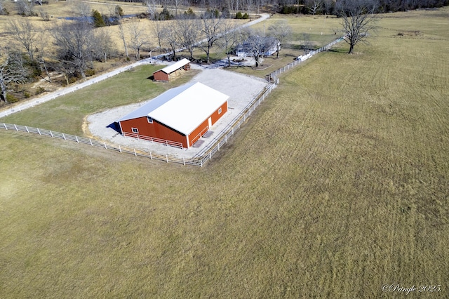 birds eye view of property featuring a rural view