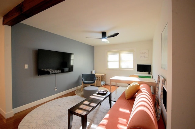 living room with wood-type flooring and ceiling fan